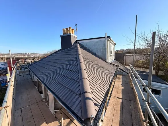 New grey tile hip seen from the scaffold, Brighton, March 2026, FR Roofing Solutions