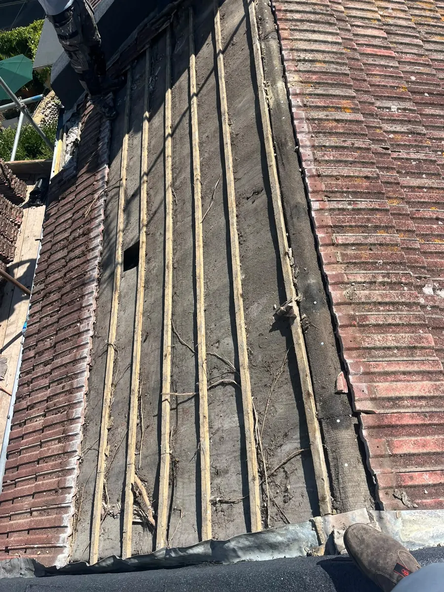 Old tiles stripped and stacked for re-use on the Brighton re-roof, FR Roofing Solutions