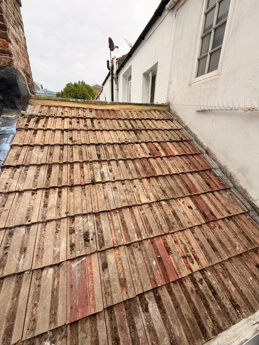 Original tiles cleaned and re-laid on the Brighton re-roof, FR Roofing Solutions