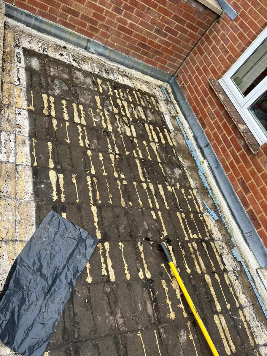 Old failed felt stripped from the East Grinstead flat roof, April 2026, FR Roofing Solutions