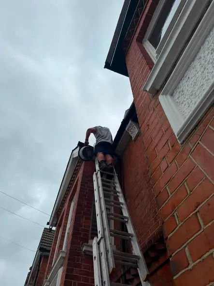 Gutter cleaning from the ladder in Brighton, August 2026, FR Roofing Solutions