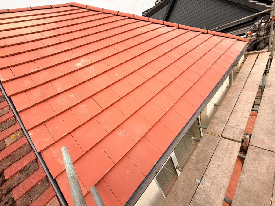 New red tile slope finished above the scaffold boards, FR Roofing Solutions