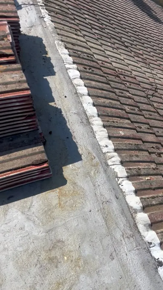 Pitched roof meeting a flat roof edge, sealed, FR Roofing Solutions