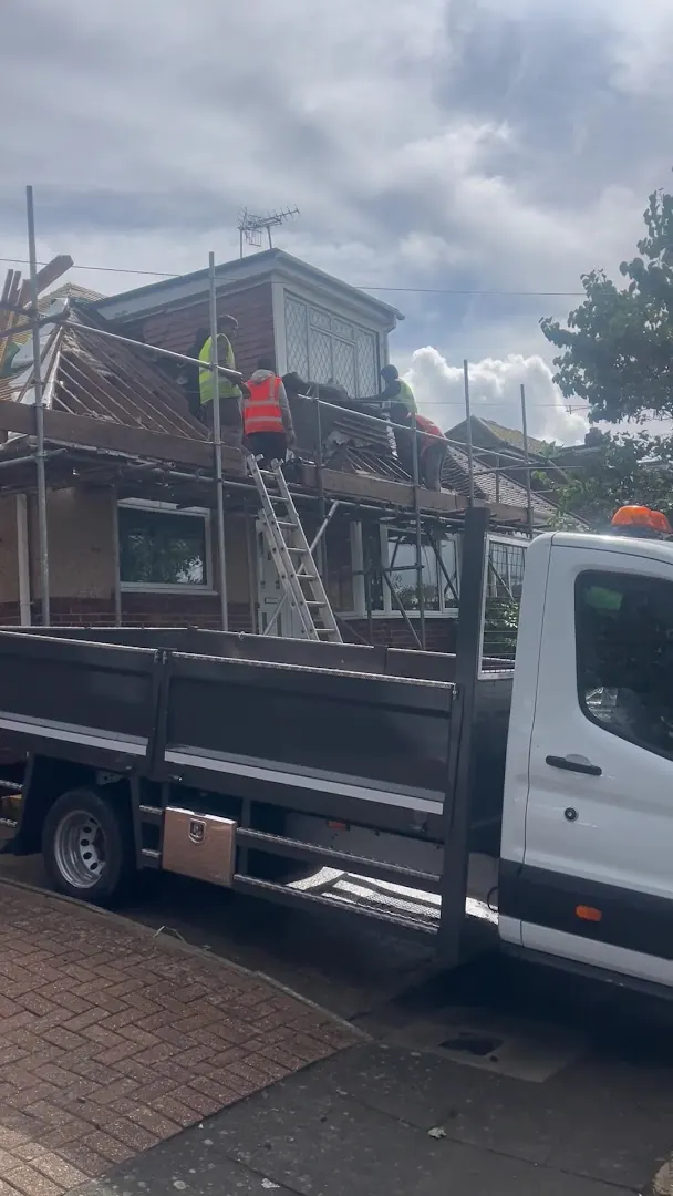 Our tipper at a scaffolded house, clearing the old roof, FR Roofing Solutions